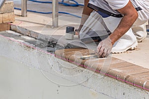 Setting new brick coping pool remodel