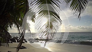 The setting sun against the Indian ocean in Seychelles