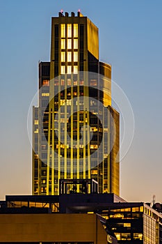 Setting sun over Omaha downtown buildings; FNBO