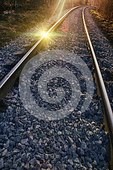 Setting sun and reflection on rails