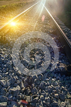 Setting sun and reflection on rails