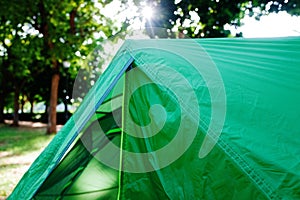 Setting up a modern tent, detail of the tensioners that support the weight of the interior cabin