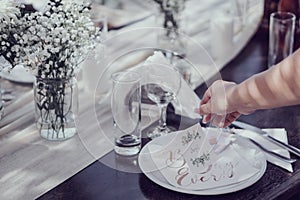 Setting the wedding reception table