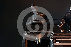 Setting wheel for ISO and aperture on an old camera photographed in the studio