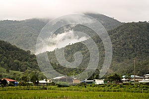 The settlement of Bario in the Borneo highlands. Surrounded by mountains covered in mist. Brio, Borneo, Malaysia photo