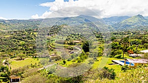 Settlement surrounded by mountains in the Yunguilla Valley, Ecuador photo