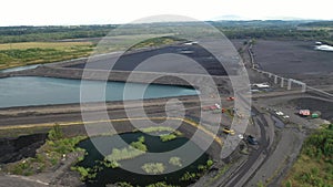 Settlement tanks for flotation tailings, black coal ask - aerial view by drone