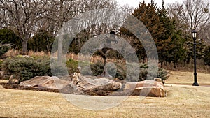 `Settling In` by Fred Boyer at the entrance to Sugar Hill residential district in Edmond, Oklahoma on Route 66.