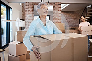 Settling in is going smoothly. a senior woman moving house with help from her daughter.