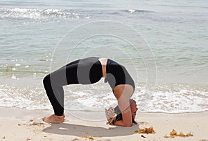 Setu Bandha Sirsasana yoga pose stock photo