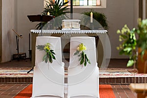 Setup of chairs with flowers for a marrage