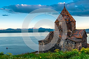 Sevanavank Monastery and Lake Sevan. Dramatic sky at sunset