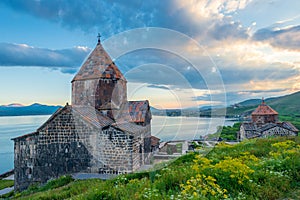 Sevanavank Monastery in the summer at sunset, dramatic sky over Lake Sevan