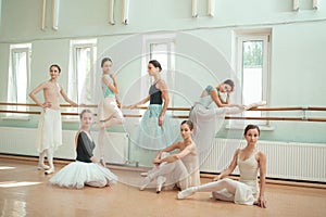 The seven ballerinas at ballet bar