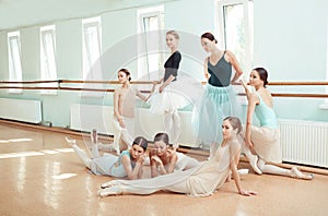 The seven ballerinas at ballet bar