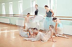 The seven ballerinas at ballet bar