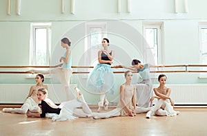 The seven ballerinas at ballet bar