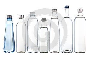 Seven bottles of drinking water isolated on white background