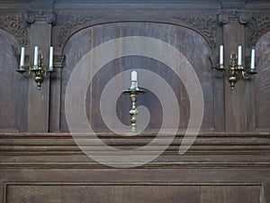 Seven candles in copper candle holders in the Portugese synagoge