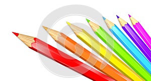 Seven colored pencils in a rainbow isolated over white.