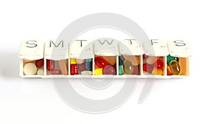 Seven day pill box with pills