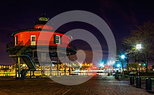 Seven Foot Knoll Lighthouse at night, in the Inner Harbor, Baltimore, Maryland. photo