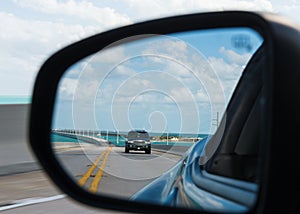 Seven Mile Bridge reflected in car mirror