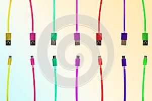 Seven multi-colored usb cables, with connectors under the micro, the different ends of the cable pointing towards each other, on a