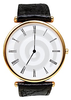 Seven o'clock on dial of wristwatch