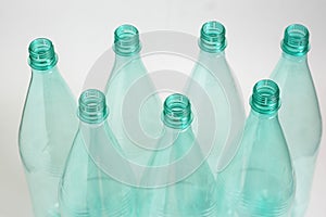 Seven plastic bottles