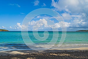 Seven Sea beach in tropical Fajardo Puerto Rico and white puffy clouds