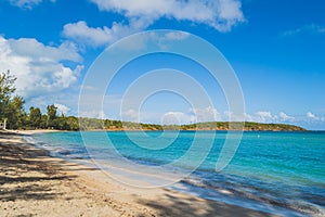 Seven Sea beach in tropical Fajardo Puerto Rico and white puffy clouds