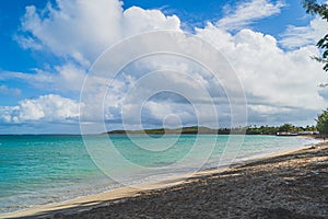 Seven Sea beach in tropical Fajardo Puerto Rico and white puffy clouds