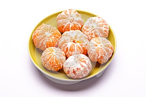 Seven shelled mandarins on saucer