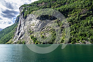 Seven Sisters waterfall over Geiranger Fjord in Sunnmore More og Romsdal Norway