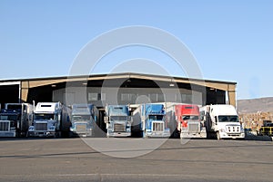 Seven trucks at warehouse