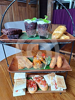 seven types of food with different tastes, colors, types and textures are displayed in a cupboard photo