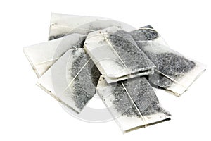 Seven Unused Tagged Teabags Placed in a Pile photo