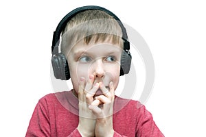 Seven year old boy with headphones singing
