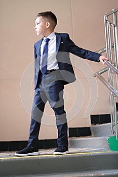 seven year standing on stairs in school