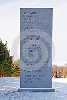 seventeen foot tall granite sculpture of grocery shopping list