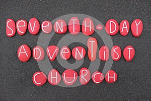Seventh-Day Adventist Church composed with red colored stones over black sand photo