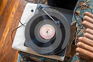 Seventies vinyl record spins on turntable.