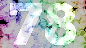 Seventy seven to seventy eight years birthday fade in/out animation with color gradient moving bokeh background.