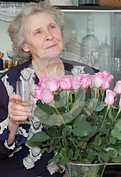 Seventy year old woman with bocal in hand photo