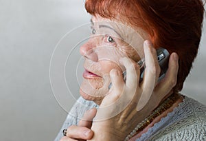 Seventy year old woman with cellphone