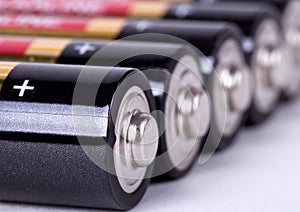 Several AA batteries in perspective closeup view