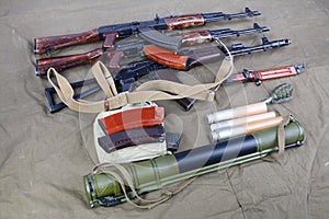 several ak 47 on canvas with ammunitions on canvas