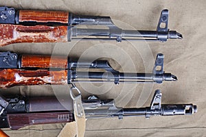 several ak 47 on canvas with ammunitions on canvas