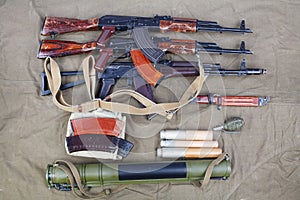 several ak 47 on canvas with ammunitions on canvas